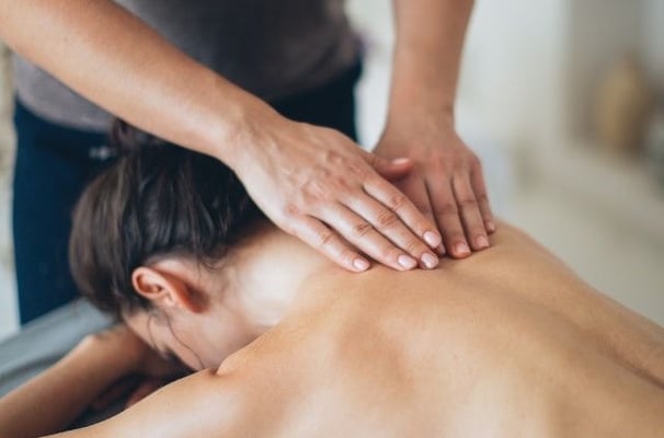 a woman getting a massage at a massager
