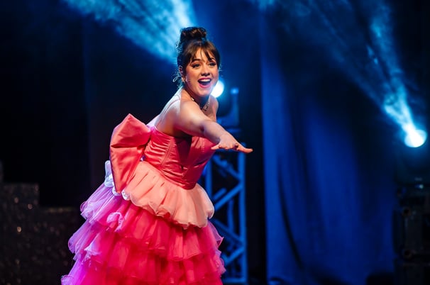 a woman in a pink dress with a pink dress