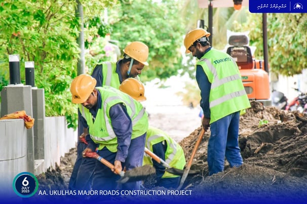 a group of people in safety vests and safety vests