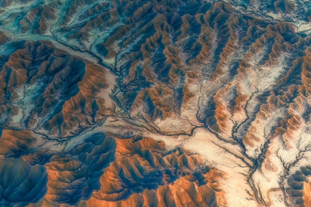 a view of a mountain range with a river running through it. arbab naimat kasi , balochistan ,pakista