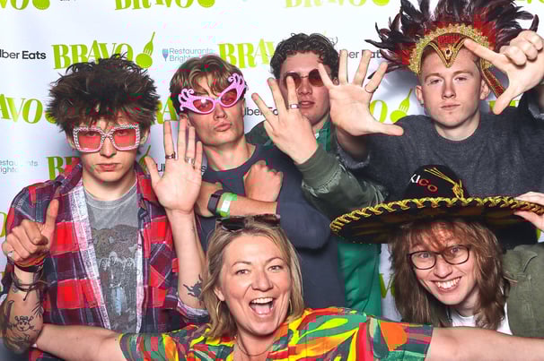 Group of young people pose for a photo in Get The Picture booth at awards ceremony party event