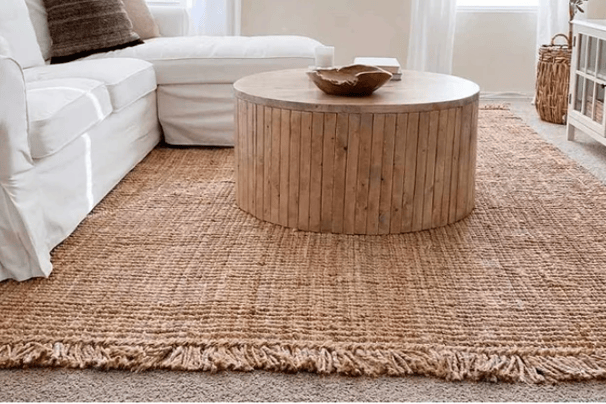 tan rug with white couch