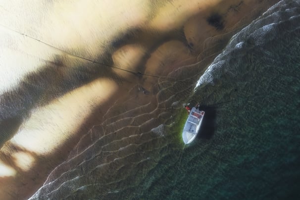 a boat on the water with a boat in the water