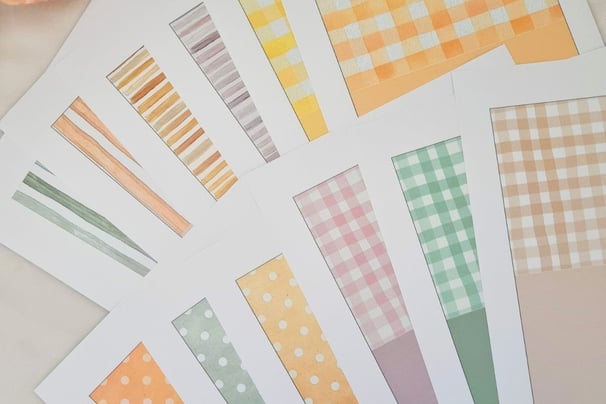 Assorted card pattern swatches on white paper featuring stripes, polka dots, and checkered designs