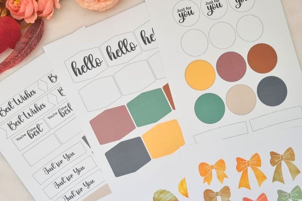 Card making cutouts sheets with messages like "hello" and "Best Wishes" in various shapes