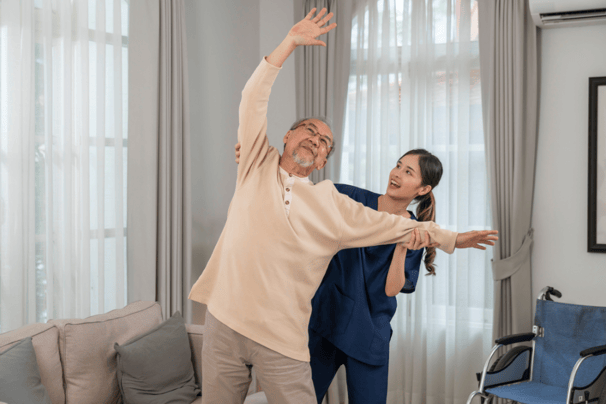 physiotherapy at home for seniors - a man doing exercises in his living room with The London Physio