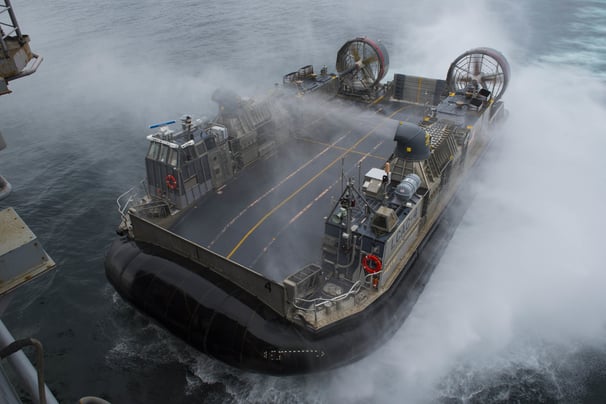 a boat with a large amount of smoke coming out of the water