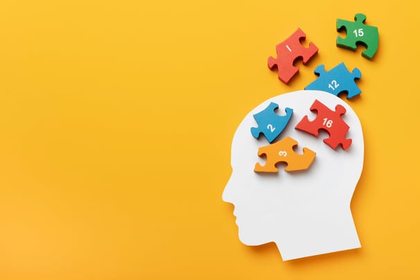 a person's head with puzzle pieces of puzzle pieces of puzzle pieces of puzzle