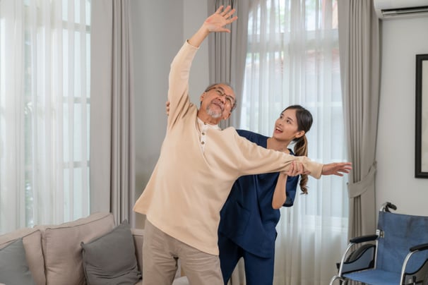 physiotherapy at home for seniors - a man doing exercises in his living room with The London Physio