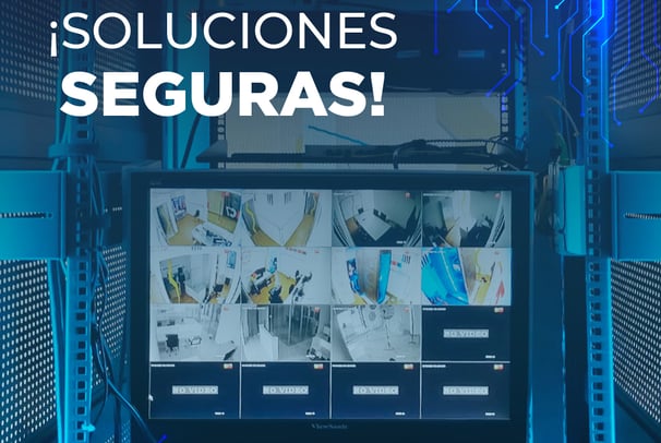 Monitor mostrando cámaras de seguridad con el texto “¡Soluciones Seguras!”.