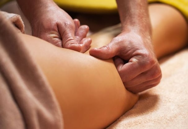 a person is getting a massage at a massage