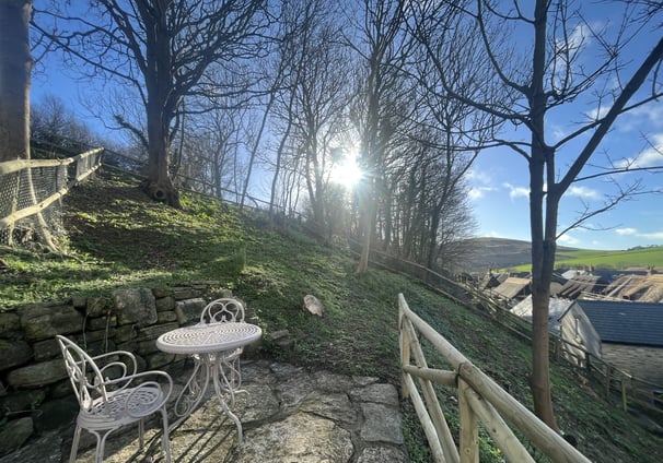 a garden from a holiday cottage overlooking west lulworth village