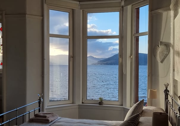 A large bedroom at Gourock Seaview Holiday Let with a view of the sea