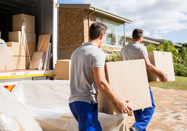 Professional Movers with Boxes and Truck