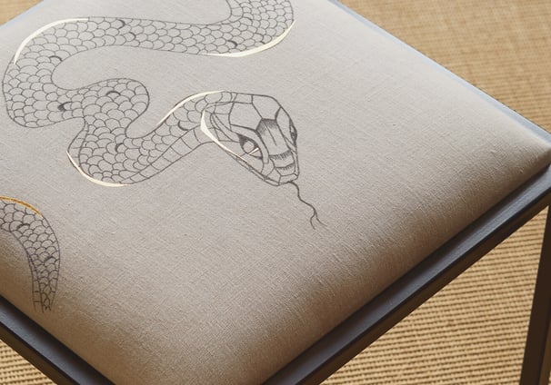 Hand-painted upholstery bespoke detail by Lumai Studio crafted for interior tones at The Falcon