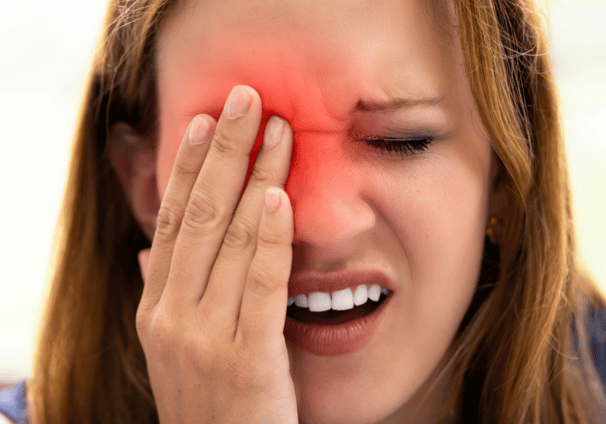 a woman with a red eye, indicating a problem 