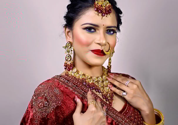 a woman in a red dress and jewelry