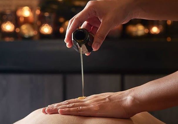 a woman getting a massage at a spa