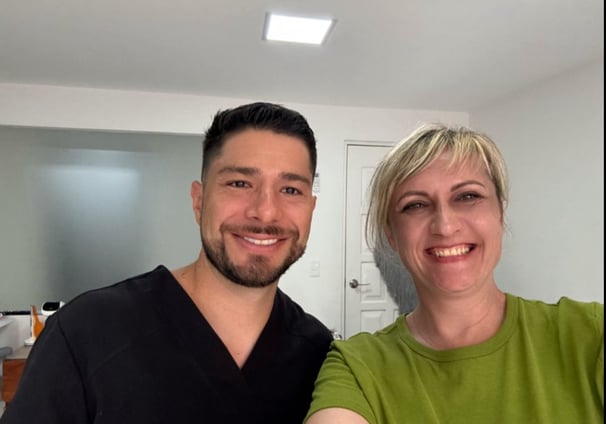 a man and woman standing in dental office Cancun Olya Freiman
