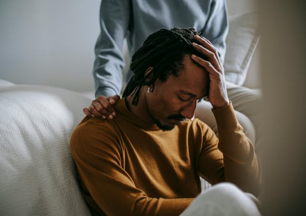 man grieving a loved one by cancer
