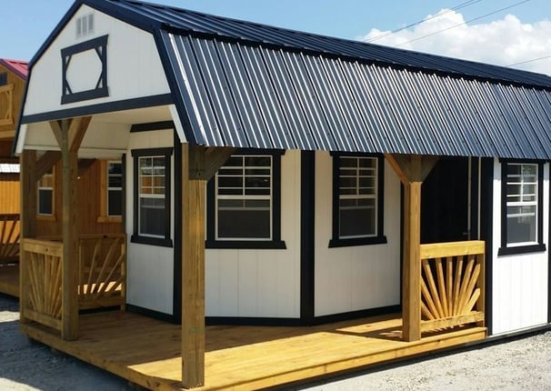 a small cabin with a porch and a porch with a porch