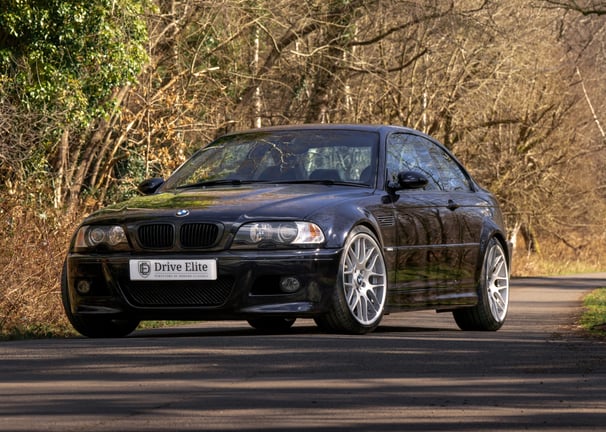 classic BMW M3 in the forest