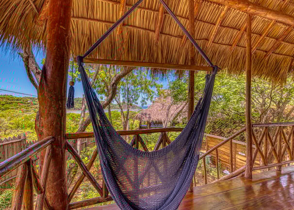 hammock at terrace overlooking garden and ocean