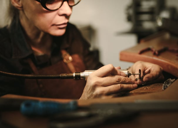 women-working-with-hands-and-tools-in-workshop-handmaking-metal-jewellery