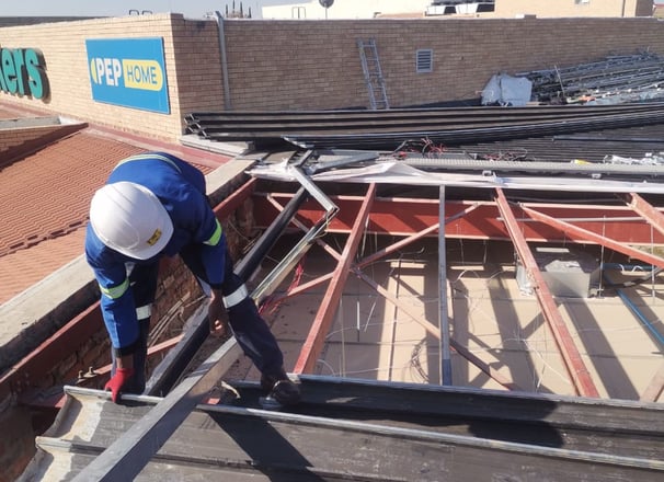 Environmental Pro Construction team replacing a roof structure on a commercial building in West Rand