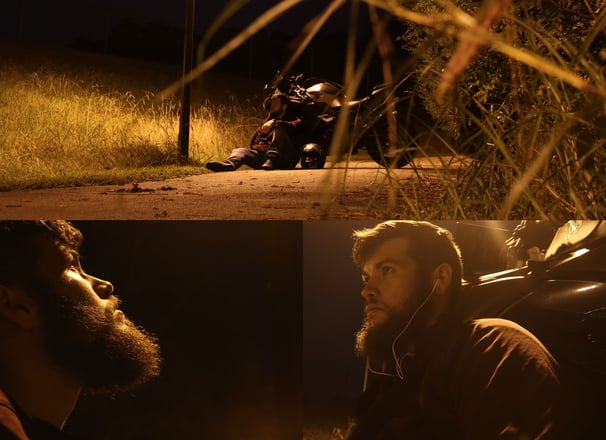 Adrien, a man with a beard and a motorcycle