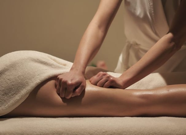 a woman getting a massage at a spa