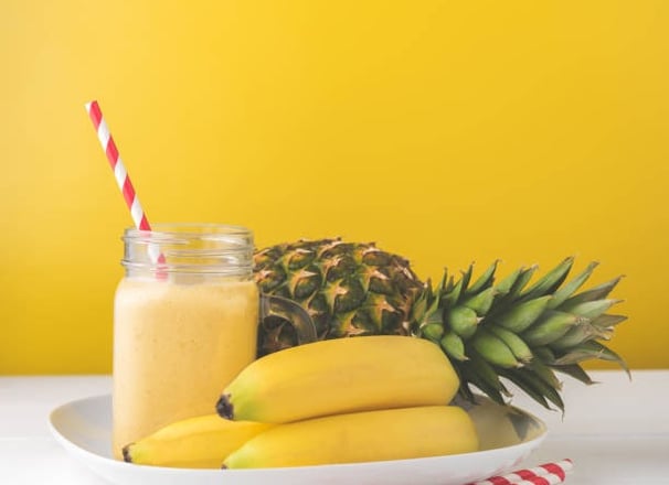 a pineapple smoothie with pineapple and pineapple