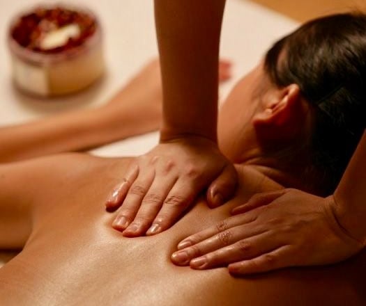 a woman getting a massage at a spa