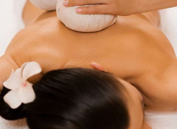 a woman getting a massage at a spa