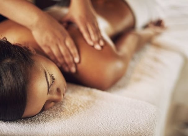 a woman getting a massage at a spa