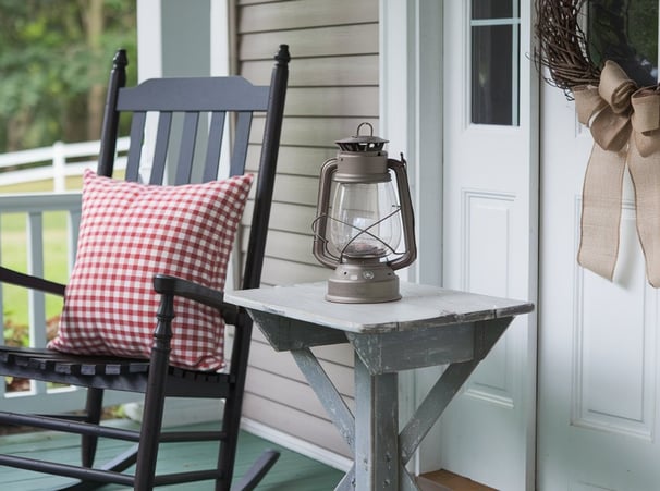 Lean into the warmth of country-inspired decor with distressed wood furniture, gingham patterns