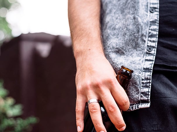 man holding a beer bottle, under the influence of Alcohol