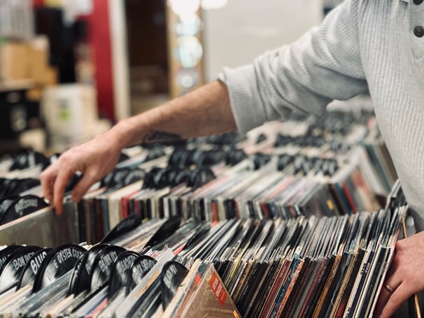 Person crate diving through vinyl records