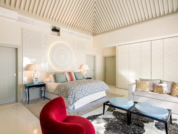 Master suite in the guest house of Villa El Rincon, Marbella, featuring stunning garden and sea views.