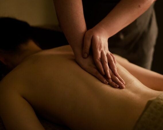 a woman getting a massage at a spa