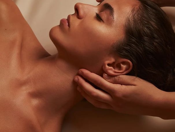 a woman getting a massage at a spa