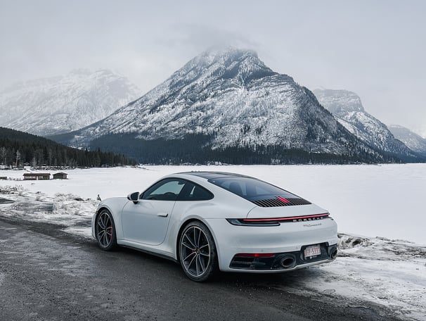 white Porsche panamera on the snow