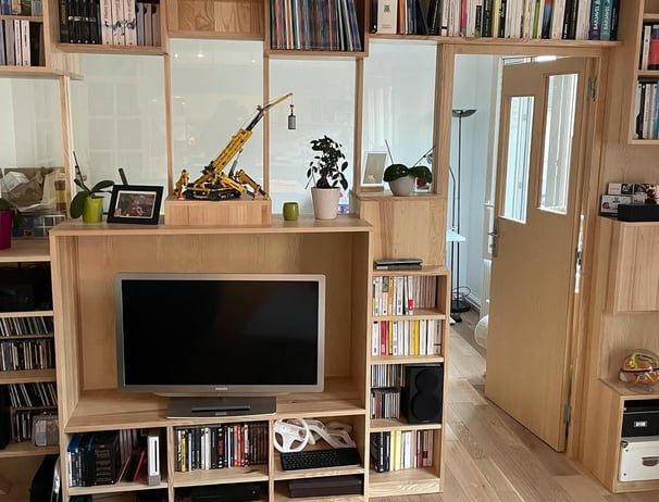 a living room with a television and a television