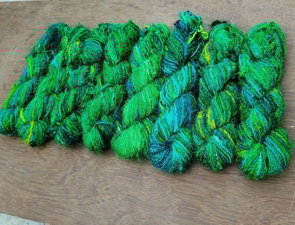 this is fine quality of recycled sari silk yarn. 125 meters of yarn in a 100 gram of skein.
