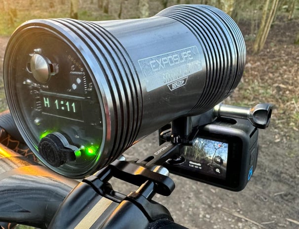 a bicycle with a camera mounted to the handlebars