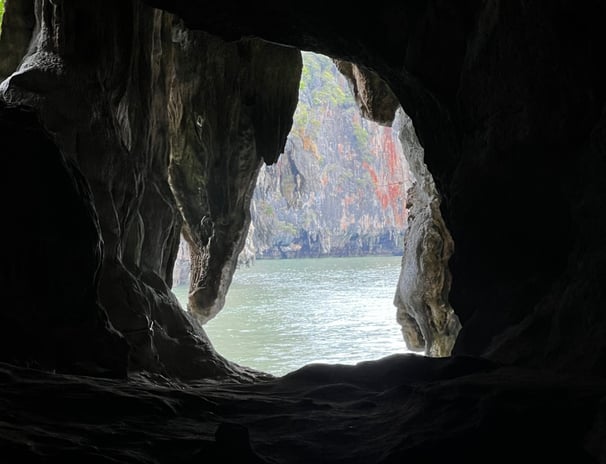 a hole at the end of a cave looks out at the Andaman Sea