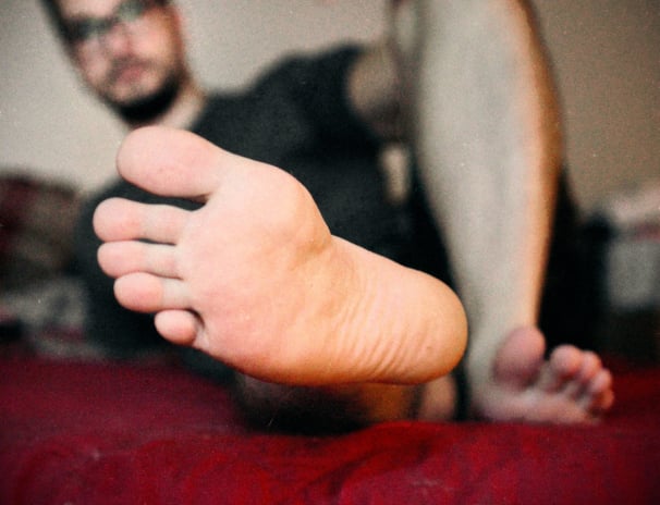 a man showing his sole