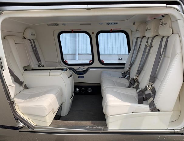 Luxurious VIP interior of AW109 Grand helicopter with premium seating and advanced features.