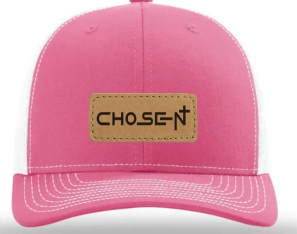 a pink hat with a leather label on it