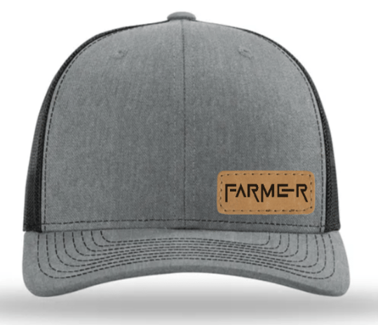 a gray and black hat with a leather patch on the front of a hat